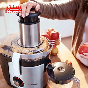 آبمیوه‌گیری بوش MES4010 در کنار میوه‌های رنگارنگ در آشپزخانه مدرن